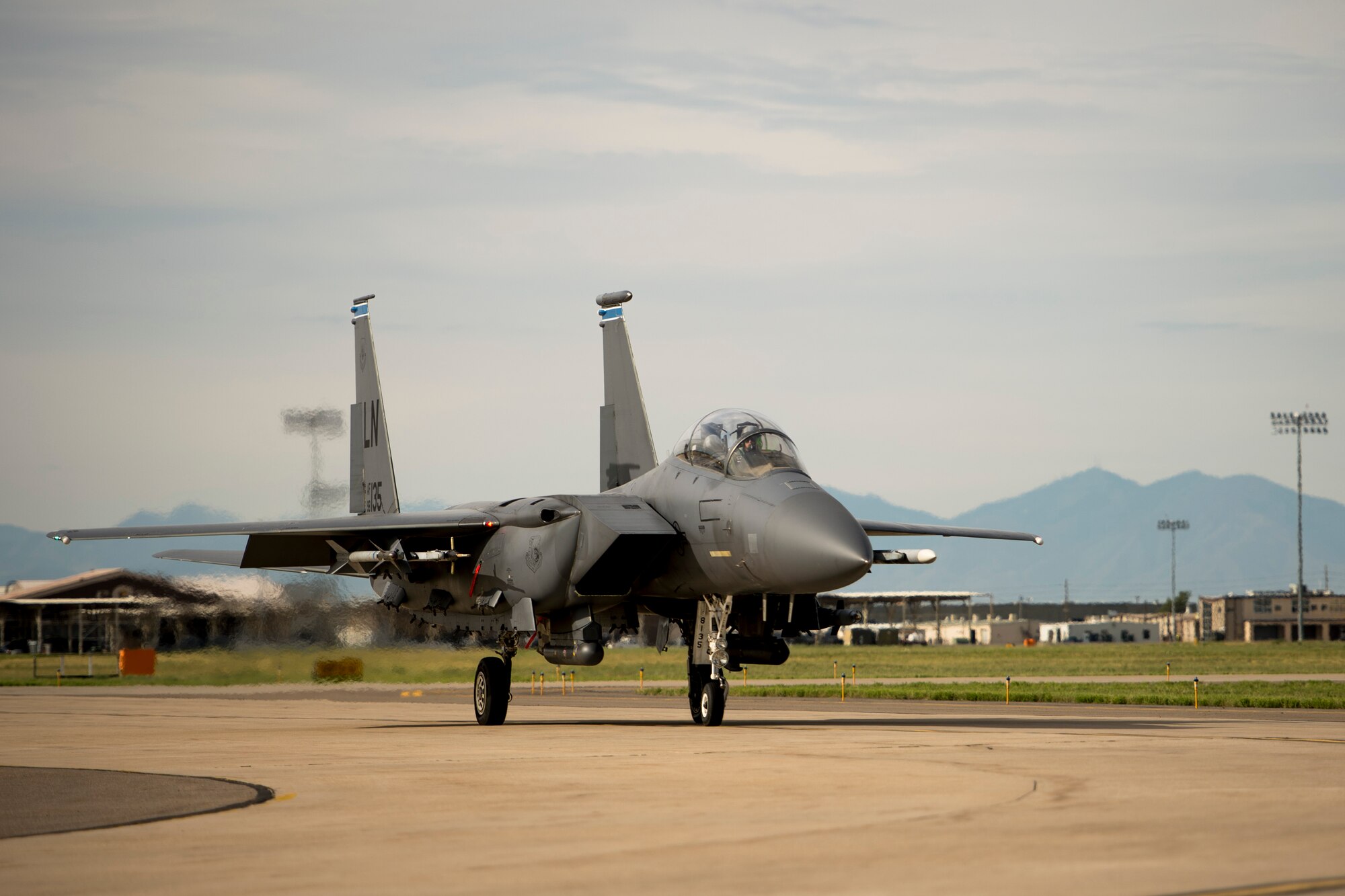 An F-15E Strike Eagle assigned to the 494th Fighter Squadron, Royal Air Force Lakenheath, England, prepares for take-off during an air-to-ground Weapons System Evaluation Program (WSEP) at Hill AFB, Utah, Aug. 13, 2014. WSEP is an annual training exercise where the effectiveness, maintainability, suitability and accuracy of guided munitions is evaluated. The 494th FS, as well as the 510th FS from Aviano Air Base, Italy, joined the 388th Fighter Wing of Hill AFB, Utah. (U.S. Air Force photo by Airman 1st Class Taylor Queen/Released)