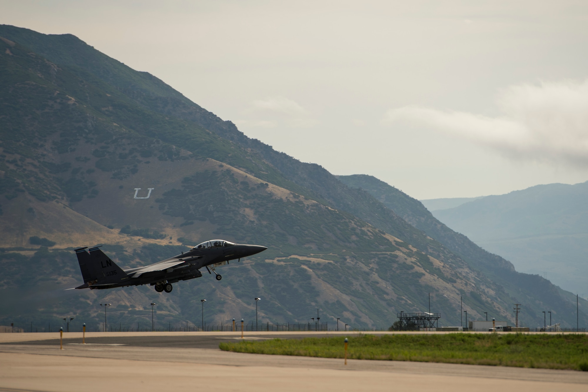 An F-15E Strike Eagle assigned to the 494th Fighter Squadron, Royal Air Force Lakenheath, England, takes off during an air-to-ground Weapons System Evaluation Program (WSEP) at Hill AFB, Utah, Aug. 13, 2014. WSEP is an annual training exercise where the effectiveness, maintainability, suitability and accuracy of guided munitions is evaluated. The 494th FS, as well as the 510th FS from Aviano Air Base, Italy joined the 388th Fighter Wing of Hill AFB, Utah.(U.S. Air Force photo by Airman 1st Class Taylor Queen/Released)