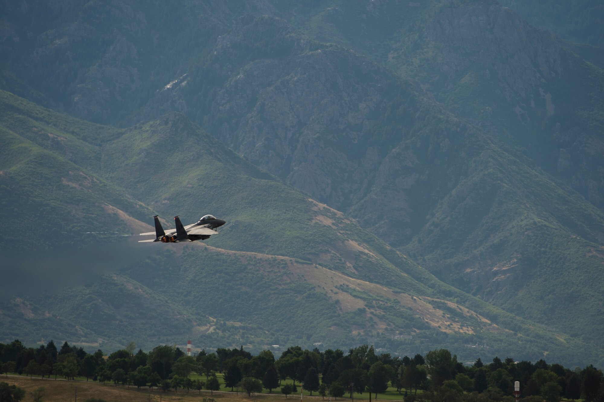 An F-15E Strike Eagle assigned to the 494th Fighter Squadron, Royal Air Force Lakenheath, England, takes off during an air-to-ground Weapons System Evaluation Program (WSEP) at Hill AFB, Utah, Aug. 13, 2014. WSEP is an annual training exercise where the effectiveness, maintainability, suitability and accuracy of guided munitions is evaluated. The 494th FS, as well as the 510th FS from Aviano Air Base, Italy joined the 388th Fighter Wing of Hill AFB, Utah.(U.S. Air Force photo by Airman 1st Class Taylor Queen/Released)