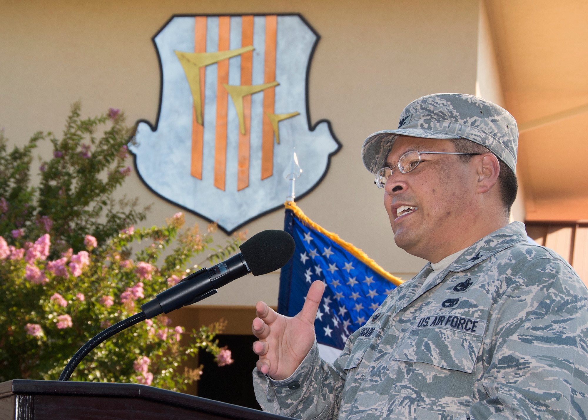 Col. Doug Bugado speaks Aug. 8 at a change of command ceremony for the 60th Mission Support Group. Bugado served as the group's commander for two years before Lt. Col. George Dietrich assumed command. (U.S. Air Force Photo/T.C. Perkins Jr.)