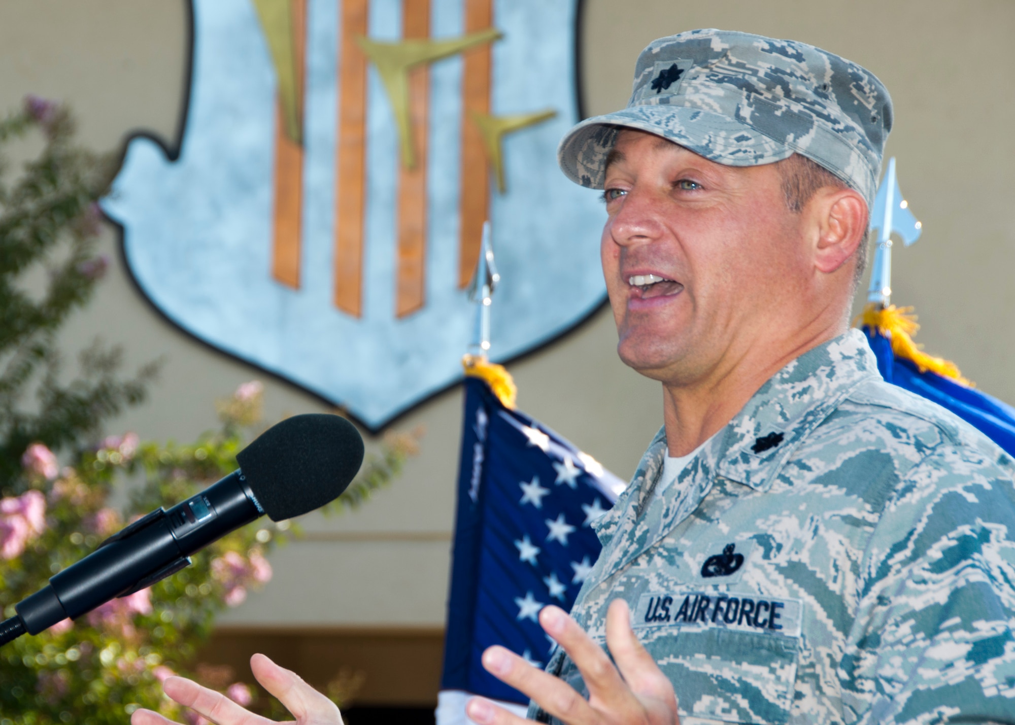 Lt.  Col. George Dietrich tells the crowd how happy he is to return to Travis and serve in his new capacity as Mission Support Group commander Aug. 8 at Travis Air Force Base. (U.S. Air Force Photo/T.C. Perkins Jr.)