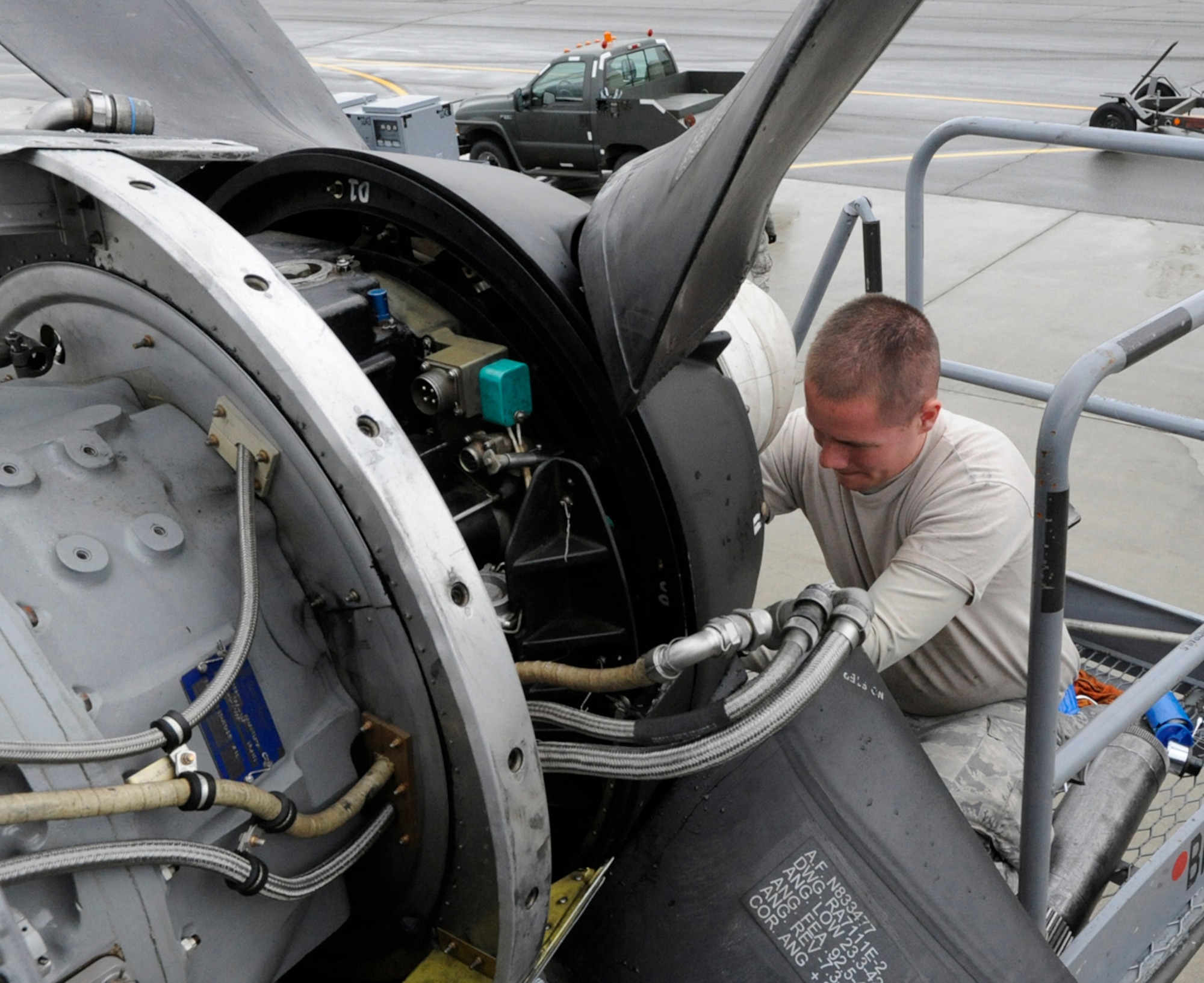 Airman 1st Class Joshua Harrison of the 374th Aircraft Maintenance Squadron works on a C-130 Hercules during Red Flag-Alaska Aug. 8. Red Flag-Alaska is a joint/coalition exercise designed to help militaries from all over the world hone their skills in simulated combat. (U.S. Air Force photo/Staff Sgt. Wes Wright)