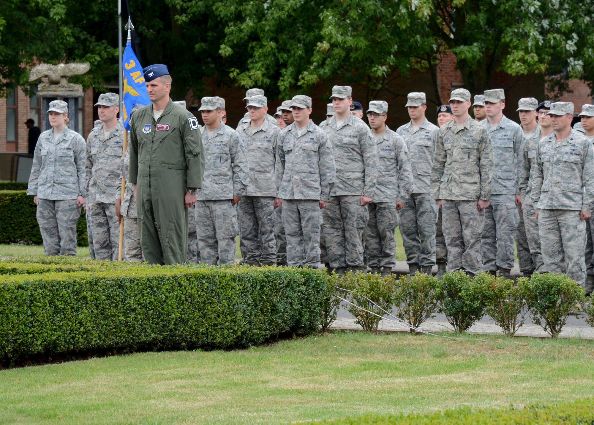 Members of Team Mildenhall and the Royal Air Force participate in a retreat ceremony concluding RAF Mildenhall’s 80th anniversary celebration Aug. 15, 2014, on RAF Mildenhall, England. Military members and their families, civilians with base access, and special guests and dignitaries celebrated the eight-decade transformation of RAF Mildenhall. (U.S. Air Force photo/Airman 1st Class Victoria  H. Taylor/Released)