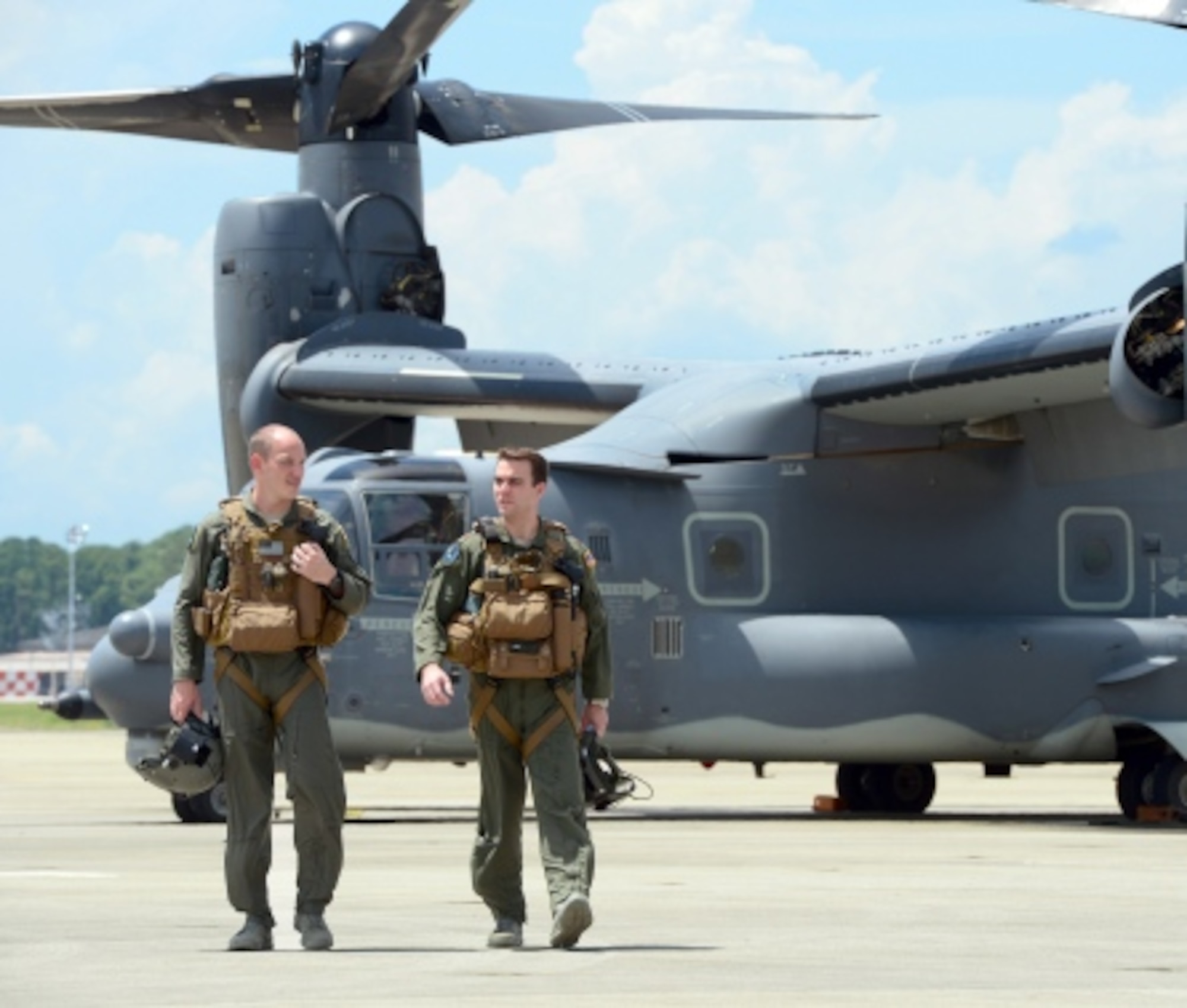 Capt. Brett Cassidy and Maj. Taylor Fingarson, 8th Special Operations Squadron pilots, discuss in-flight operations at Hurlburt Field, Fla., Aug. 12, 2014. (U.S. Air Force photo/Airman 1st Class Jeff Parkinson)

