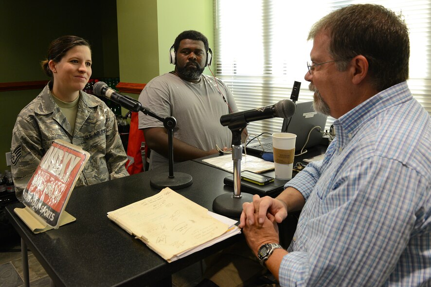 U.S. Air Force Staff Sgt. Shelby Bird, 20th Force Support Squadron Senior Master Sgt. David B. Reid Airman Leadership School instructor, talks live with Derek Burress, Good Morning Sumter! radio show host, about the importance of ALS at Shaw Air Force Base, S.C., Aug. 15, 2014. The show, broadcast on WDXY 1240 AM and 105.9 FM, is hosted on base the first and third Fridays of every month and features interviews with Air Force and Army personnel. (U.S. Air Force photo by Airman 1st Class Diana M. Cossaboom/Released)