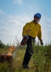 CJ Mahon, a Jackson Guard firefighter, lights hay on fire for a recent exercise at Duke Field Fla.  The members of Jackson Guard’s wildland fire center are responsible for controlling and maintaining Eglin’s natural resources and operations areas through controlled burning of the it’s forests.  (U.S. Air Force photo/Tech. Sgt. Jasmin Taylor)