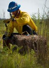 CJ Mahon, a Jackson Guard firefighter, prepares to light hay on fire for a recent exercise at Duke Field Fla.  The members of Jackson Guard’s wildland fire center are responsible for controlling and maintaining Eglin’s natural resources and operations areas through controlled burning of the it’s forests.  (U.S. Air Force photo/Tech. Sgt. Jasmin Taylor)