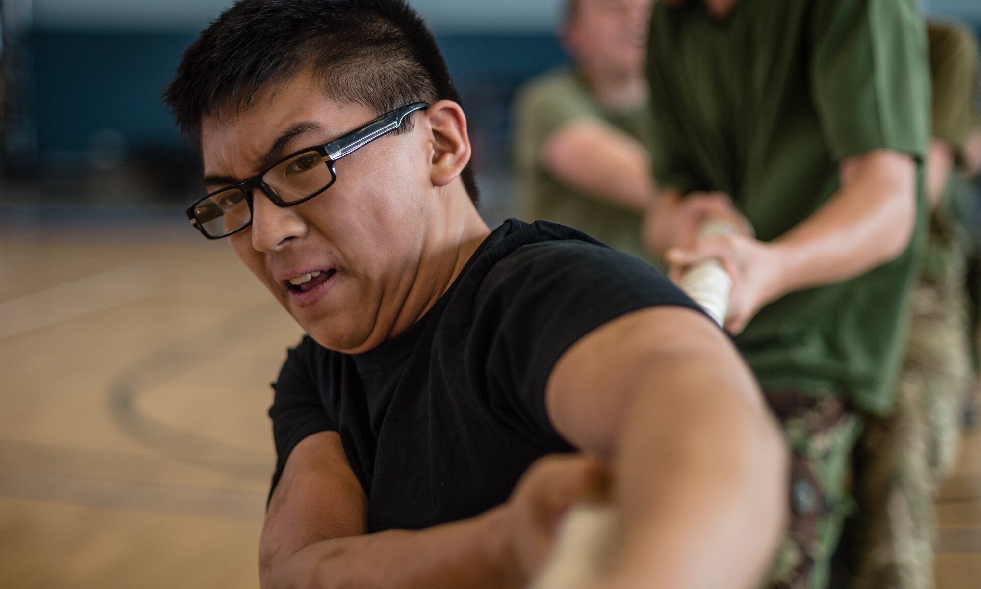 British Air Training Corps Cadet Ryon Chan, 2349th ATC, participates in a match of tug-o-war on Vogelweh Military Complex, Germany, Aug. 14, 2014. The cadets from England, Whales and Northern Ireland took part in the event that immersed them into the life of a U.S. Air Force NCO attending the Kisling NCOA. (U.S. Air Force photo/Airman 1st Class Jordan Castelan)