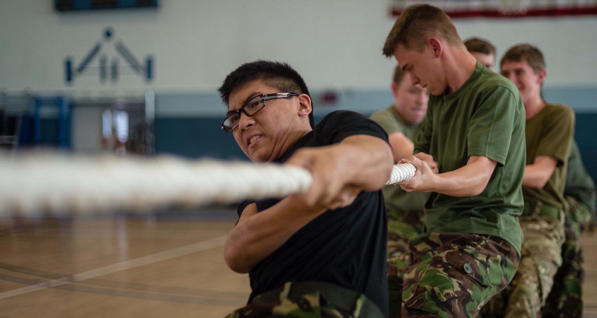 British Air Training Corps Cadet Ryon Chan, 2349th ATC, participates in a match of tug-o-war on Vogelweh Military Complex, Germany, Aug. 14, 2014. The cadets from England, Whales and Northern Ireland took part in the event that immersed them into the life of a U.S. Air Force NCO attending the Kisling NCOA. (U.S. Air Force photo/Airman 1st Class Jordan Castelan)