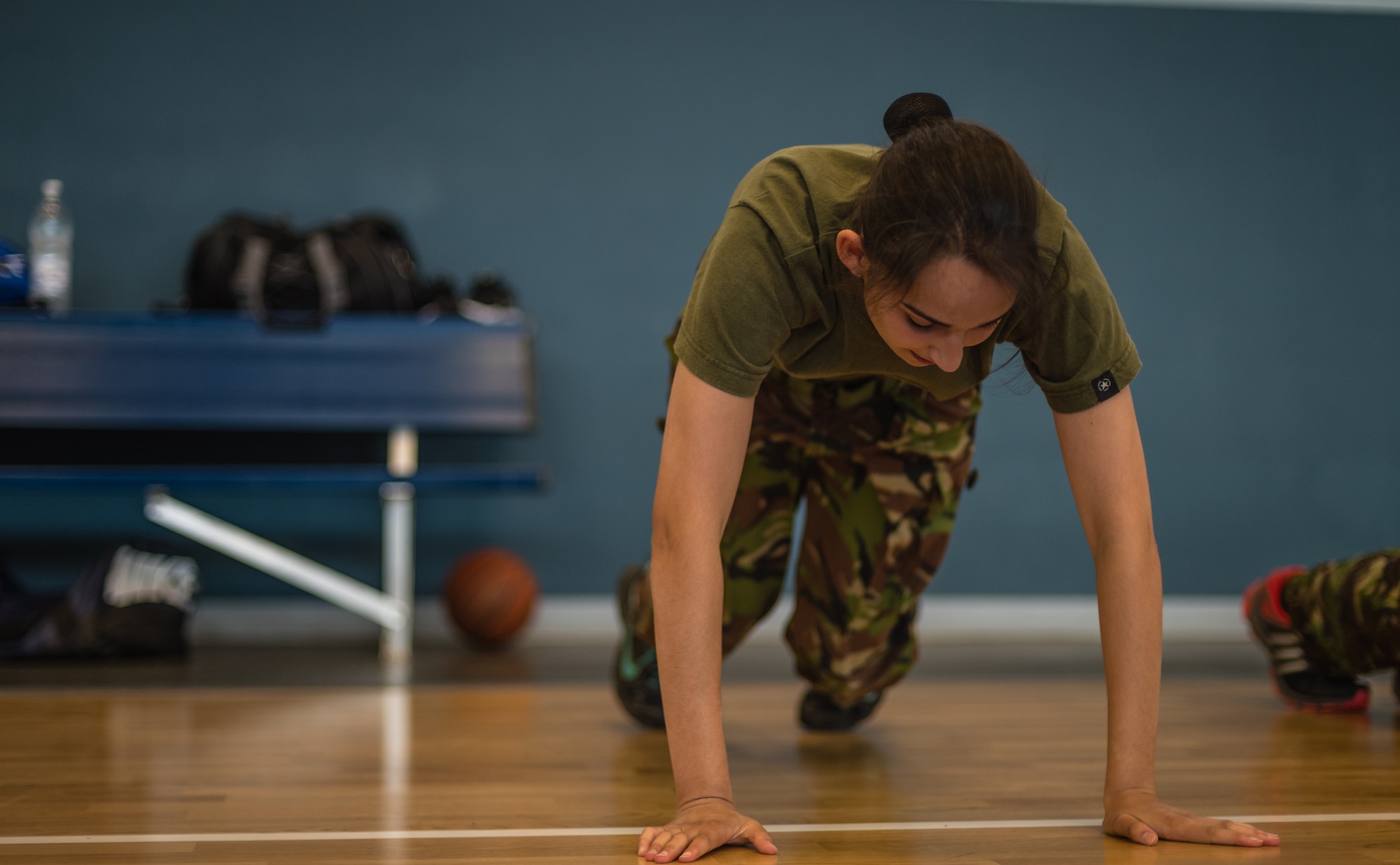 British Air Training Corps Sgt. Natacha Abvery, 457th ATC, participates in a physical training exercise on Vogelweh, Germany, Aug. 14, 2014. Cadets from England, Whales and Northern Ireland took part in an event that immersed them into the life of an Air Force NCO attending the Kisling NCOA. (U.S. Air Force photo/Airman 1st Class Jordan Castelan)