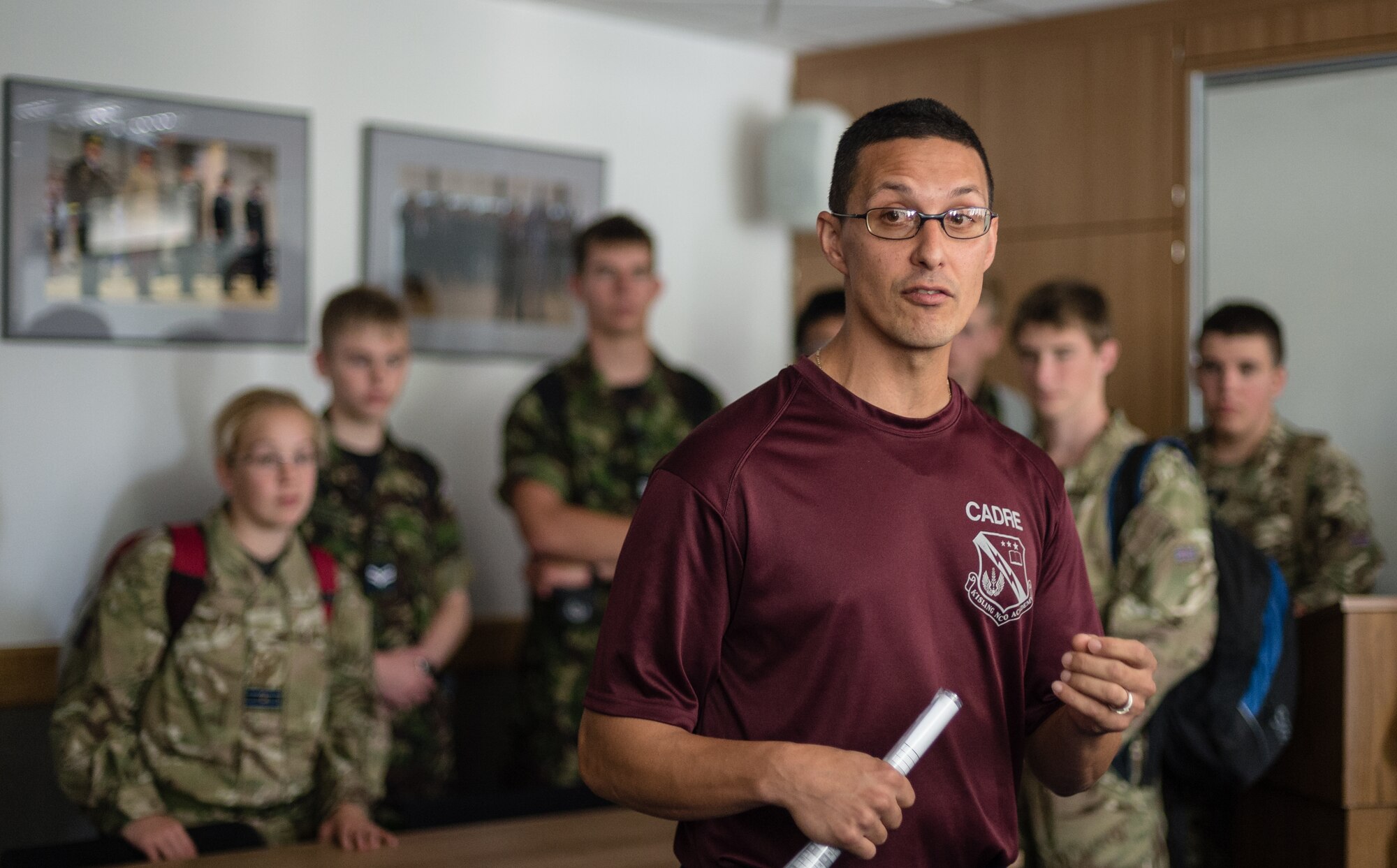 Tech. Sgt. Alexander Ortiz, U.S. Air Forces Europe Kisling Noncommissioned Officer Academy instructor, briefs a group of British Air Training Corps cadets about life as a student at the Kisling NCOA onVogelweh Military Complex, Germany, Aug. 14, 2014. The cadets from England, Whales and Northern Ireland took part in the event that immersed them into the life of a U.S. Air Force NCO attending the Kisling NCOA. (U.S. Air Force photo/Airman 1st Class Jordan Castelan)