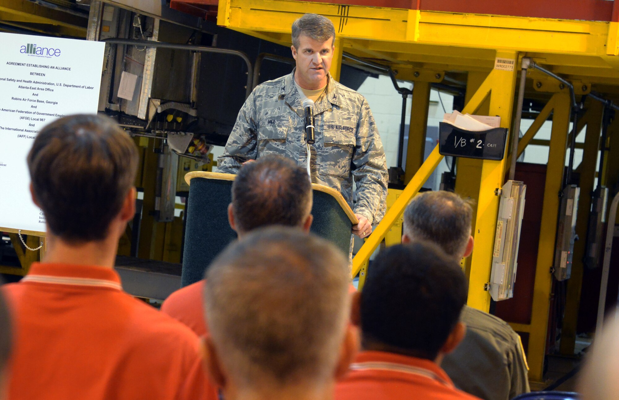 Col. Christopher Hill, Installation commander, speaks during the OSHA alliance signing ceremony at Building 169, August 8, 2014. (U.S. Air Force photo by Ray Crayton)