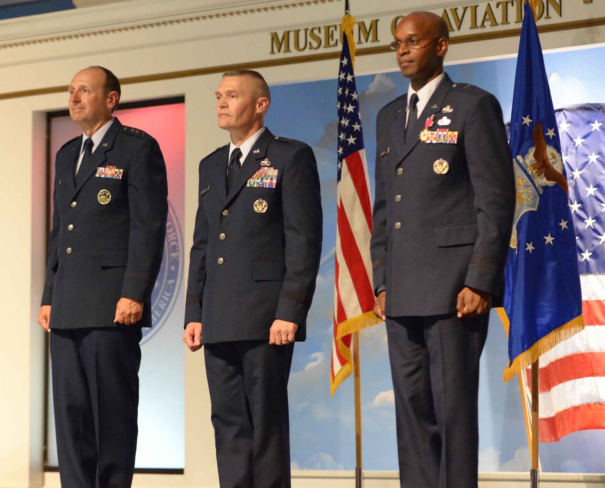 From left, Lt. Gen. Bruce Litchfield, Air Force Sustainment Center Commander, Brig. Gen. Walter Lindsley, Warner Robins Air Logistics Complex commander and Brig. Gen Cedric George, outgoing WR-ALC Complex commander, during the change-of-command ceremony August 11, 2014. (US. Air Force photo by Ray Crayton)