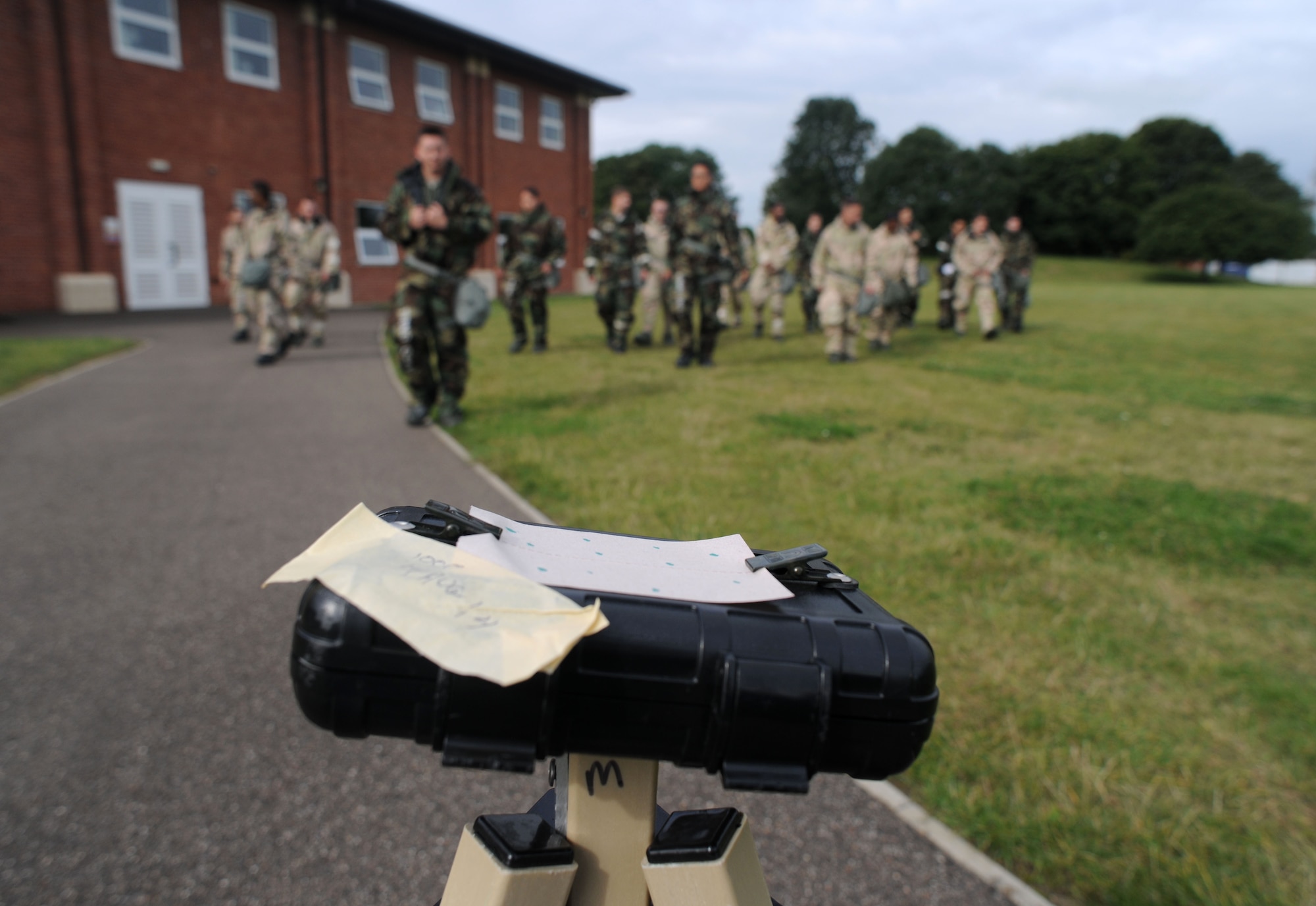 M-9 paper shows simulated contamination during a chemical, biological, radiological and nuclear training class Aug. 14, 2014, at building 680 on RAF Mildenhall, England. While performing a simulated post-attack inspection, the Airmen checked the paper for changes in color to determine if there are chemical agents in the air. (U.S. Air Force photo/Senior Airman Kate Maurer/Released)