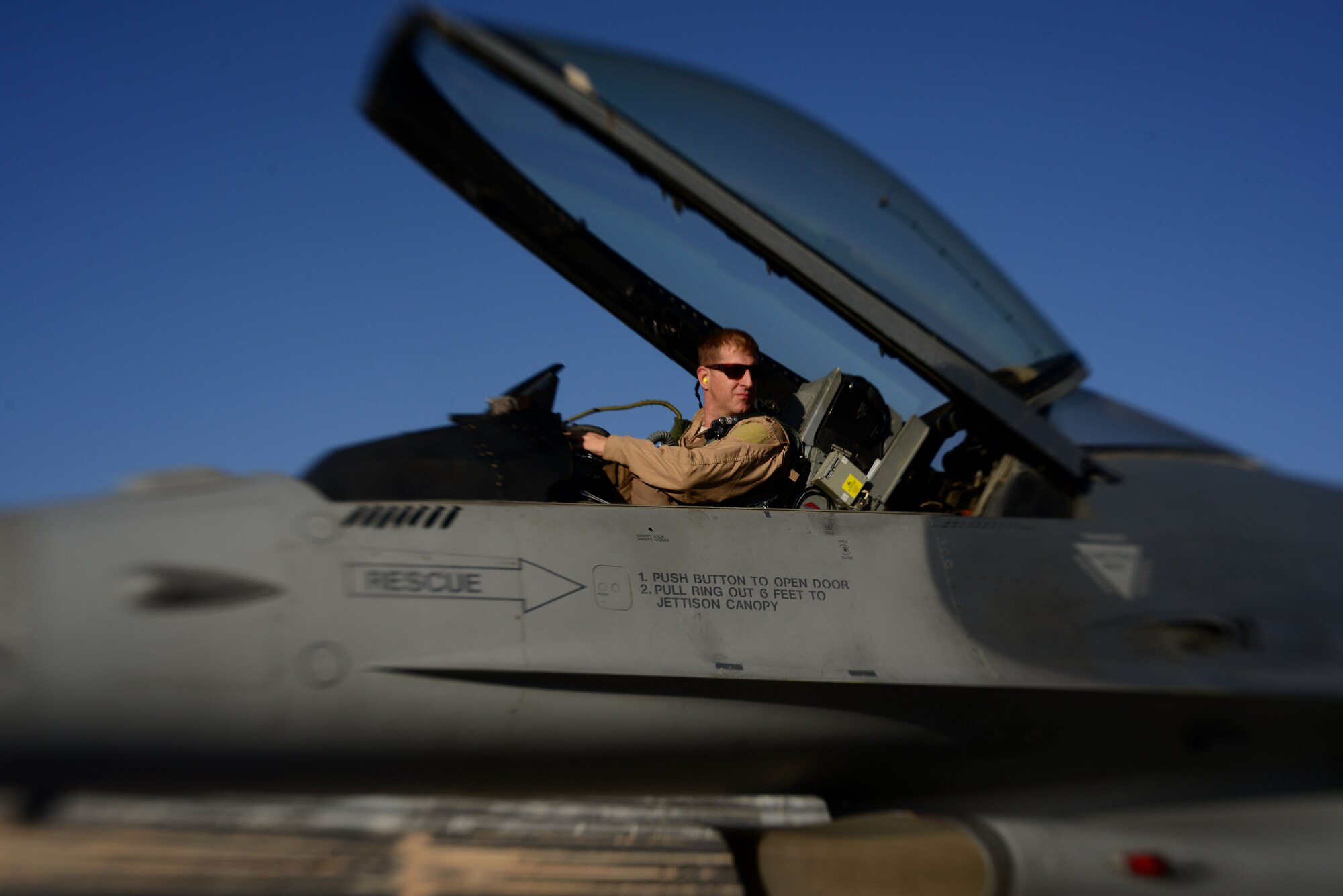 U.S. Air Force Major Raymond Fowler, a pilot with the 100th Expeditionary Fighter Squadron “Red Tails”, prepares for a sortie at Bagram Airfield, Afghanistan Aug. 7, 2014. The F-16 “Fighting Falcon” is a compact, multi-role fighter aircraft that is highly maneuverable in air-to-air combat and air-to-surface attacks. The unit is deployed from the 187th Fighter Wing in Montgomery, Ala. Fowler is deployed from the Alabama National Guard and a native of Atlanta, Ga. (U.S. Air Force photo by Staff Sgt. Evelyn Chavez/Released)