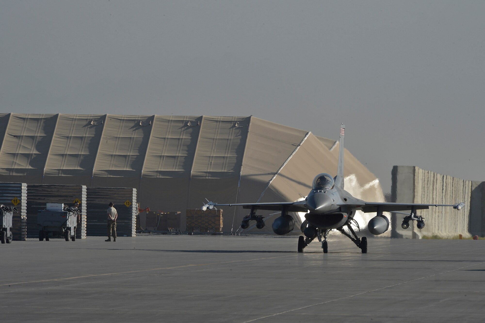 U.S. Air Force F-16 “Fighting Falcon” with the 100th Expeditionary Fighter Squadron “Red Tails” taxi’s at Bagram Airfield, Afghanistan Aug. 7, 2014. The 100 EFS launch around-the-clock in support of Operation Enduring Freedom.  The unit is deployed from the 187th Fighter Wing in Montgomery, Ala. (U.S. Air Force photo by Staff Sgt. Evelyn Chavez/Released)