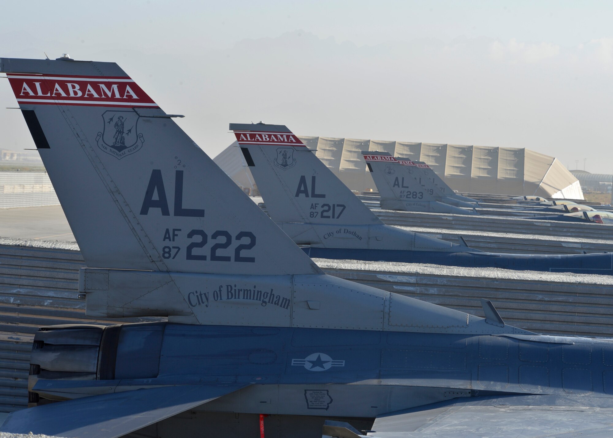Several U.S. Air Force F-16 “Fighting Falcons” assigned to the 100th Expeditionary Fighter Squadron “Red Tails” sit at Bagram Airfield, Afghanistan Aug. 7, 2014. The F-16 “Fighting Falcon” is a compact, multi-role fighter aircraft that is highly maneuverable in air-to-air combat and air-to-surface attacks. The unit is deployed from the 187th Fighter Wing in Montgomery, Ala. (U.S. Air Force photo by Staff Sgt. Evelyn Chavez/Released)