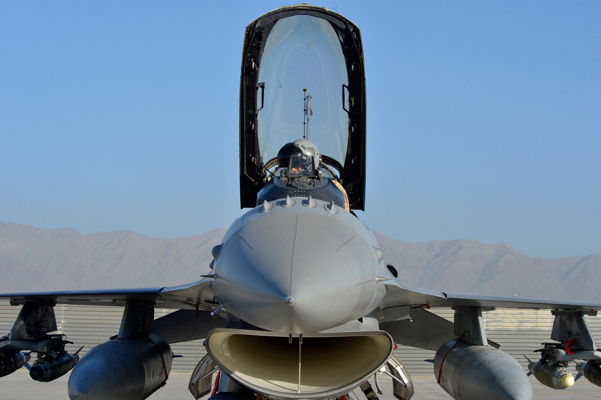 U.S. Air Force Major Raymond Fowler, a pilot with the 100th Expeditionary Fighter Squadron “Red Tails”, prepares for a sortie at Bagram Airfield, Afghanistan Aug. 7, 2014. The F-16 “Fighting Falcon” is a compact, multi-role fighter aircraft that is highly maneuverable in air-to-air combat and air-to-surface attacks. The unit is deployed from the 187th Fighter Wing in Montgomery, Ala. Fowler is deployed from the Alabama National Guard and a native of Atlanta, Ga. (U.S. Air Force photo by Staff Sgt. Evelyn Chavez/Released)