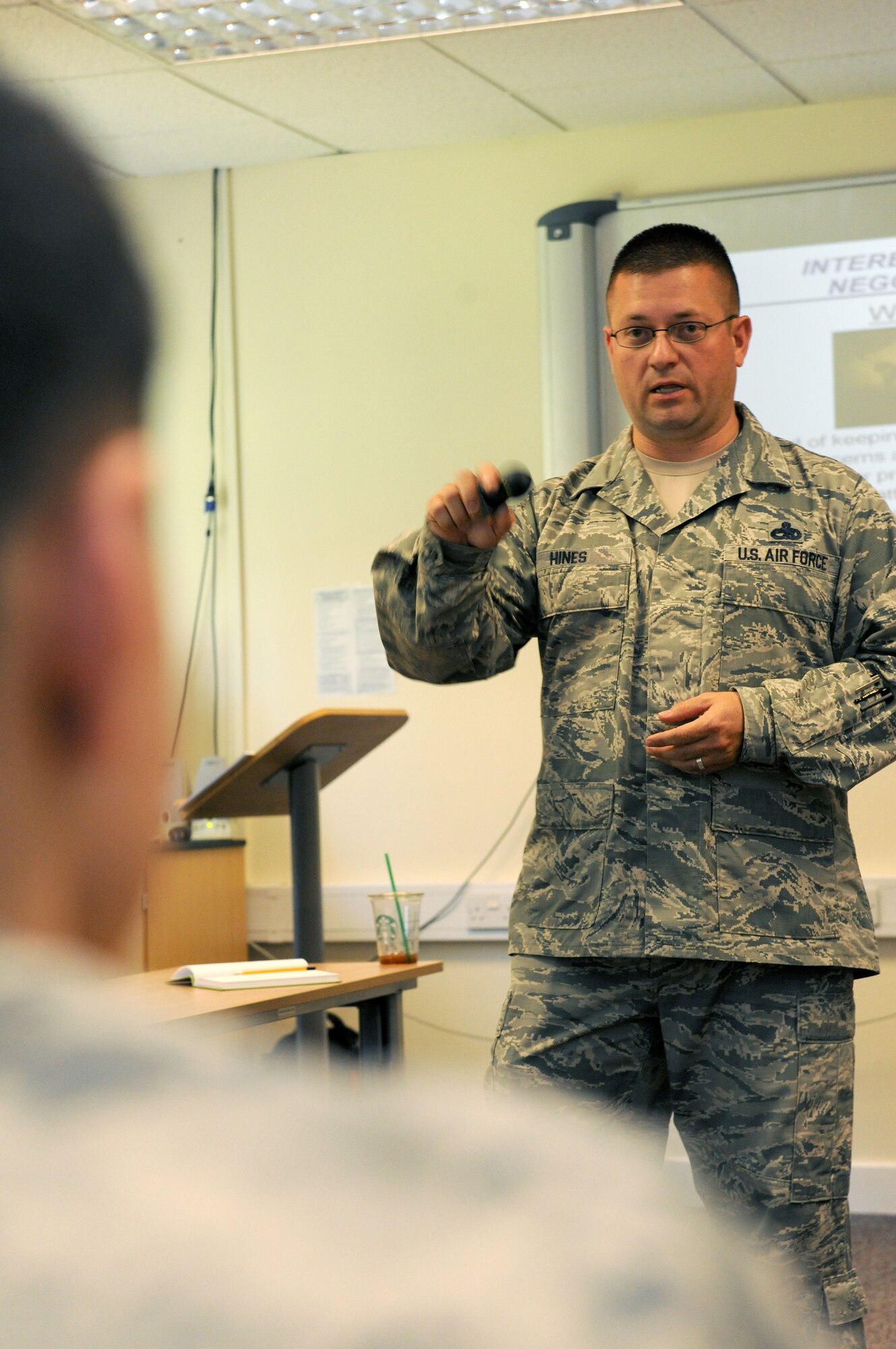 U.S. Air Force Senior Master Sgt. Timothy Hines, 95th Reconnaissance Squadron lead production superintendent from Fort Hood, Texas, talks to Airmen about conflict resolution pertaining to the aircraft maintenance world during a Conflict Management Course Aug. 13, 2014, at the 100th Air Refueling Wing Professional Development Center on RAF Mildenhall, England. Anyone interested in leading a course or seminar should contact the PDC for more information at DSN 238-5933 or commercial at 01638-545933. (U.S. Air Force photo/Senior Airman Kate Maurer/Released)