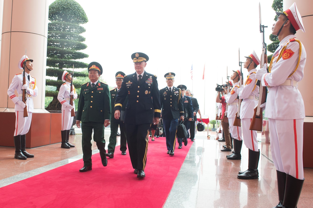 Army Gen. Martin E. Dempsey, chairman of the Joint Chiefs of Staff, and Lt. Gen. Do Ba T?, Vietnamese chief of defense, in Hanoi, Vietnam, Aug. 14, 2014. DoD photo by D. Myles Cullen