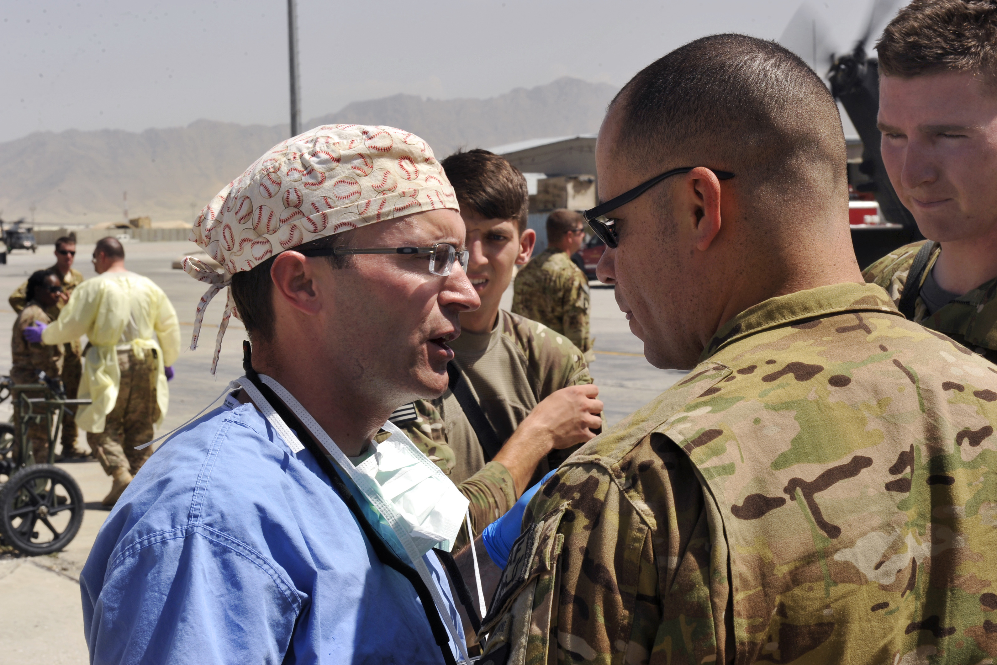 U.S. Air Force Lt. Col. Keyan Riley, left, speaks with U.S. Army Maj ...