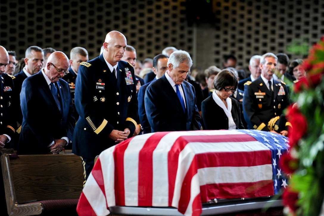 Army Chief of Staff Gen. Ray Odierno, left, Defense Secretary Chuck Hagel, center, and Heidi Shyu, the assistant secretary of the Army for acquisition, logistics and technology, bow their heads for benediction during a military funeral to honor U.S. Army Maj. Gen. Harold J. Greene on Joint Base Myer-Henderson Hall in Arlington, Va., Aug. 14, 2014.