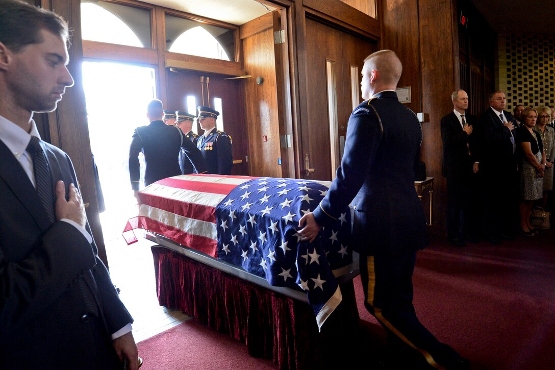 The flag-draped casket of  Army Maj. Gen. Harold J. Greene leaves the chapel during a military funeral on Joint Base Myer-Henderson Hall in Arlington, Va., Aug. 14, 2014. 