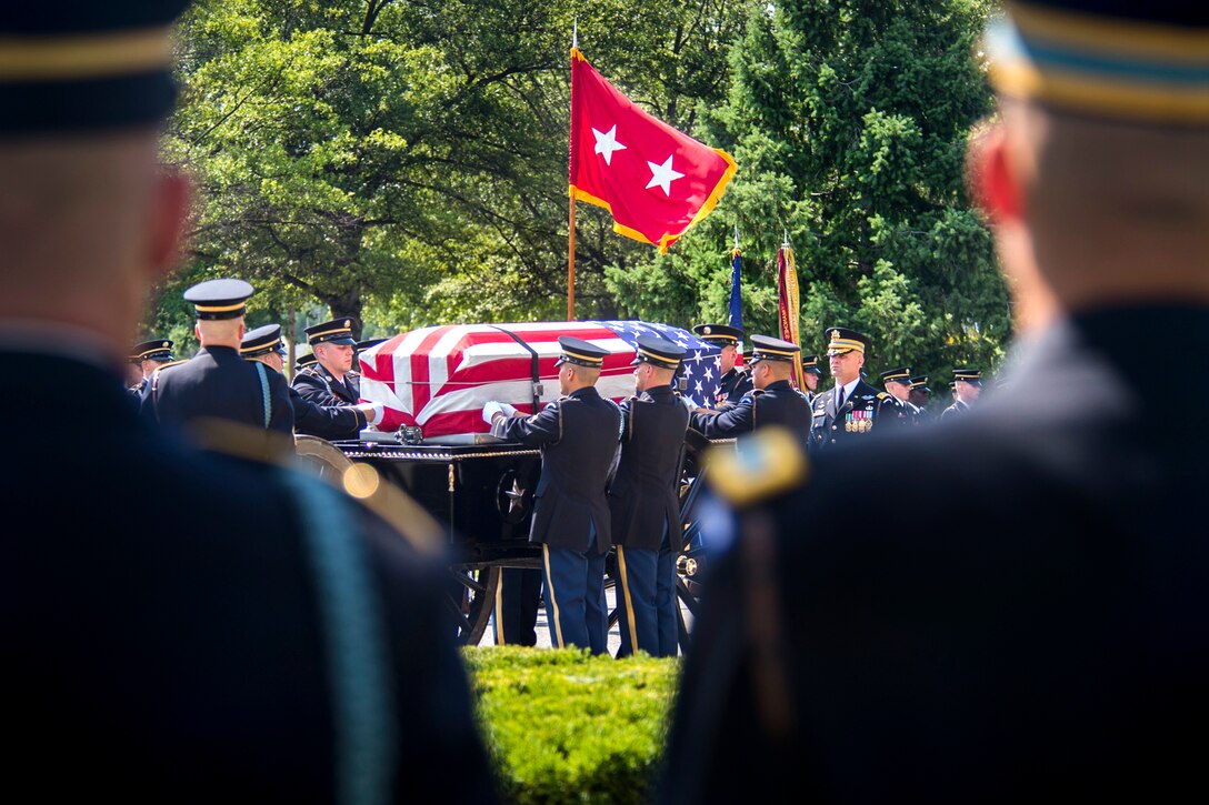 Soldiers carry he flag-draped casket of Army Maj. Gen. Harold J. Greene from the chapel during a military funeral on Joint Base Myer-Henderson Hall in Arlington, Va., Aug. 14, 2014.