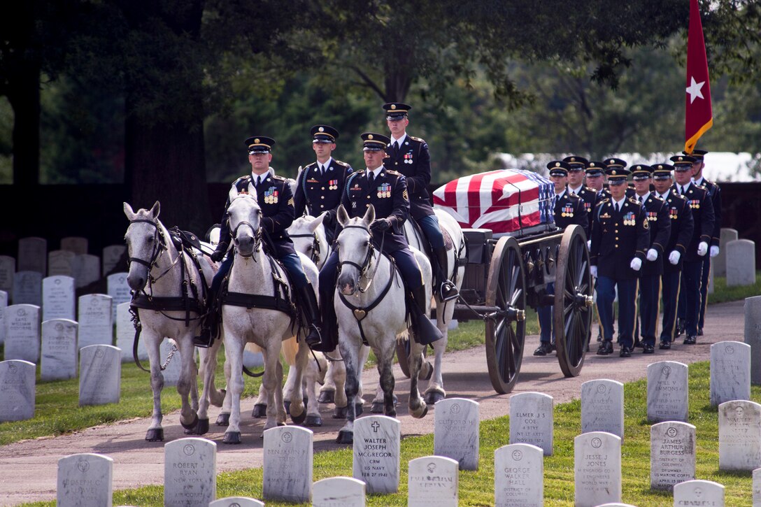 The funeral procession of Army Maj. Gen. Harold J. Greene enters Arlington National Cemetery during a military funeral in Arlington, Va., Aug. 14, 2014. 