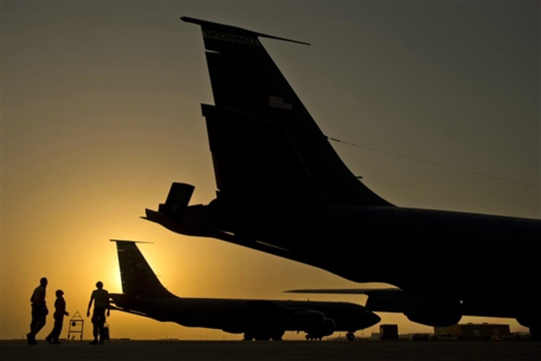 Morgan and Jacob Manuel before an in-air refueling mission over Iraq, Aug. 12, 2014. Before each mission, the aircraft commander does a walk-around inspection to validate the safety of the aircraft. Delosreues, a KC-135 Stratotanker pilot, and Morgan and Manuel, KC-135 Stratotanker engine mechanics, are assigned to the 340th Expeditionary Air Refueling Squadron. 