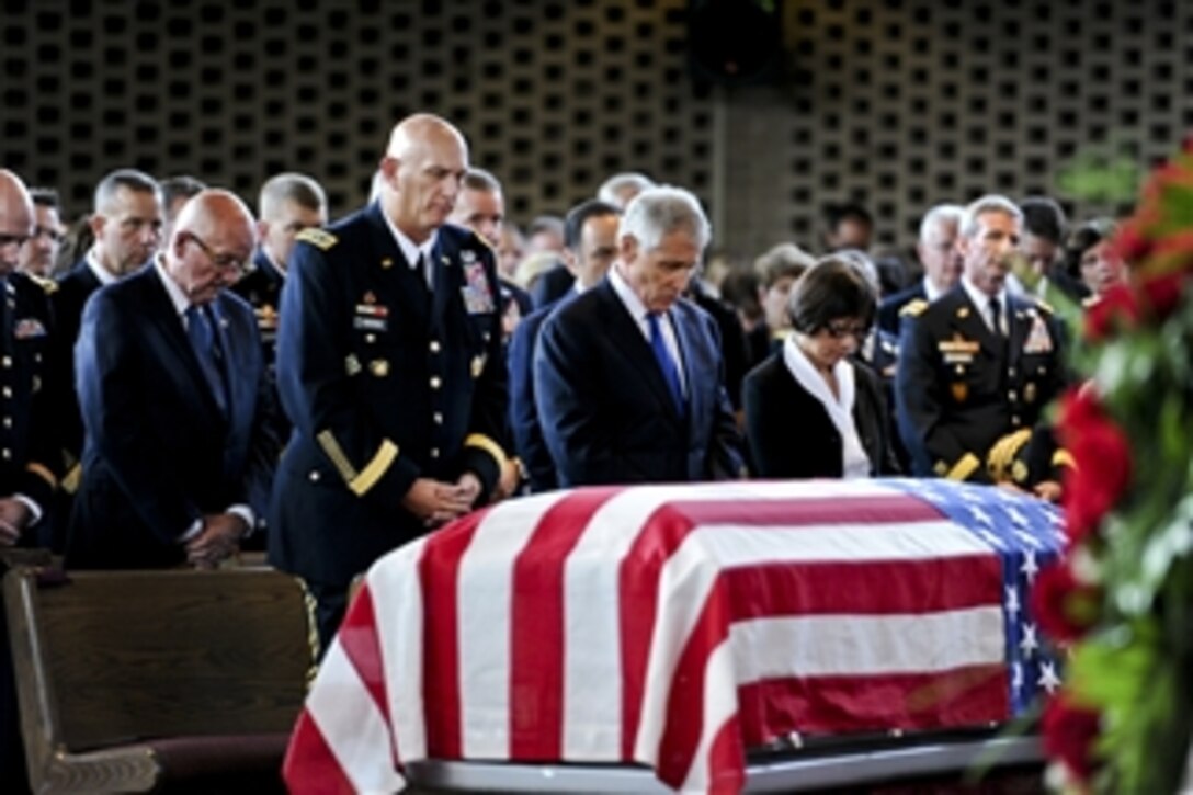 Army Chief of Staff Gen. Ray Odierno, left, Defense Secretary Chuck Hagel, center, and Heidi Shyu, the assistant secretary of the Army for acquisition, logistics and technology, bow their heads for benediction during a military funeral to honor U.S. Army Maj. Gen. Harold J. Greene on Joint Base Myer-Henderson Hall in Arlington, Va., Aug. 14, 2014. 