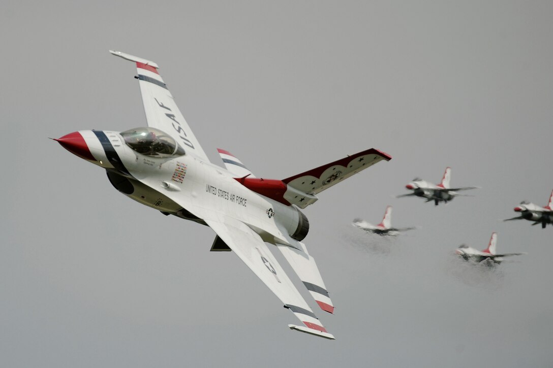 F-16 Fighting Falcon Thunderbirds with the U.S. Air Force Air Demonstration Squadron perform aerial maneuvers Aug. 3, 2014, during the Experimental Aircraft Association's annual AirVenture event in Oshkosh, Wis. (U.S. Air Force photo/Master Sgt. Stan Parker) 