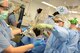 U.S. Air Force Captain Amanda Eagan, an operating room nurse, opens a wound vac sponge for Airman 1st Class German Martinez, an orthopedic scrub technician, that will be placed on the wound of a patient while the in the operating room of the Craig Joint Theater Hospital, Bagram Airfield, Afghanistan, Aug. 5, 2014. The vac sponge will then be attached to a suction cup to help speed the healing process. Eagan and Martinez are both deployed from Joint Base San Antonio, Texas. (U.S. Air Force photo by Master Sgt. Cohen A. Young/Released) 