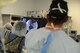 U.S. Air Force Senior Airman Freddy Toruno, 455th Expeditionary Medical Support Squadron diagnostic imaging technologist, points at the point of a fracture on an X-ray to Maj. Ryan Finnan, an orthopedic surgeon, during a surgery on a patient in an operating room of the Craig Joint Theater Hospital, Bagram Airfield, Afghanistan, Aug. 5, 2014. The medical staff of CJTH and 159th Combat Aviation Brigade, “DUSTOFF,” administered emergency care to victims involved in a mass casualty event. Finnan is deployed from the Center for the Sustainment of Trauma and Readiness Skills in Cincinnati, Ohio. (U.S. Air Force photo by Master Sgt. Cohen A. Young/Released)