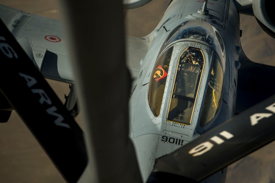A U.S. Air Force A-10 Thunderbolt II with the 303rd Expeditionary Fighter Squadron, Bagram Airfield, Afghanistan, receives fuel from a KC-135 Stratotanker from the 340th Expeditionary Air Refueling Squadron out of Al Udeid Air Base, Qatar over Eastern Afghanistan, July 10, 2014. The A-10's maneuverability at slow speeds and low altitude has made it one of the most utilized aircraft for close air support throughout Operation Enduring Freedom. (U.S. Air Force photo by Senior Airman Matthew Bruch/Released)