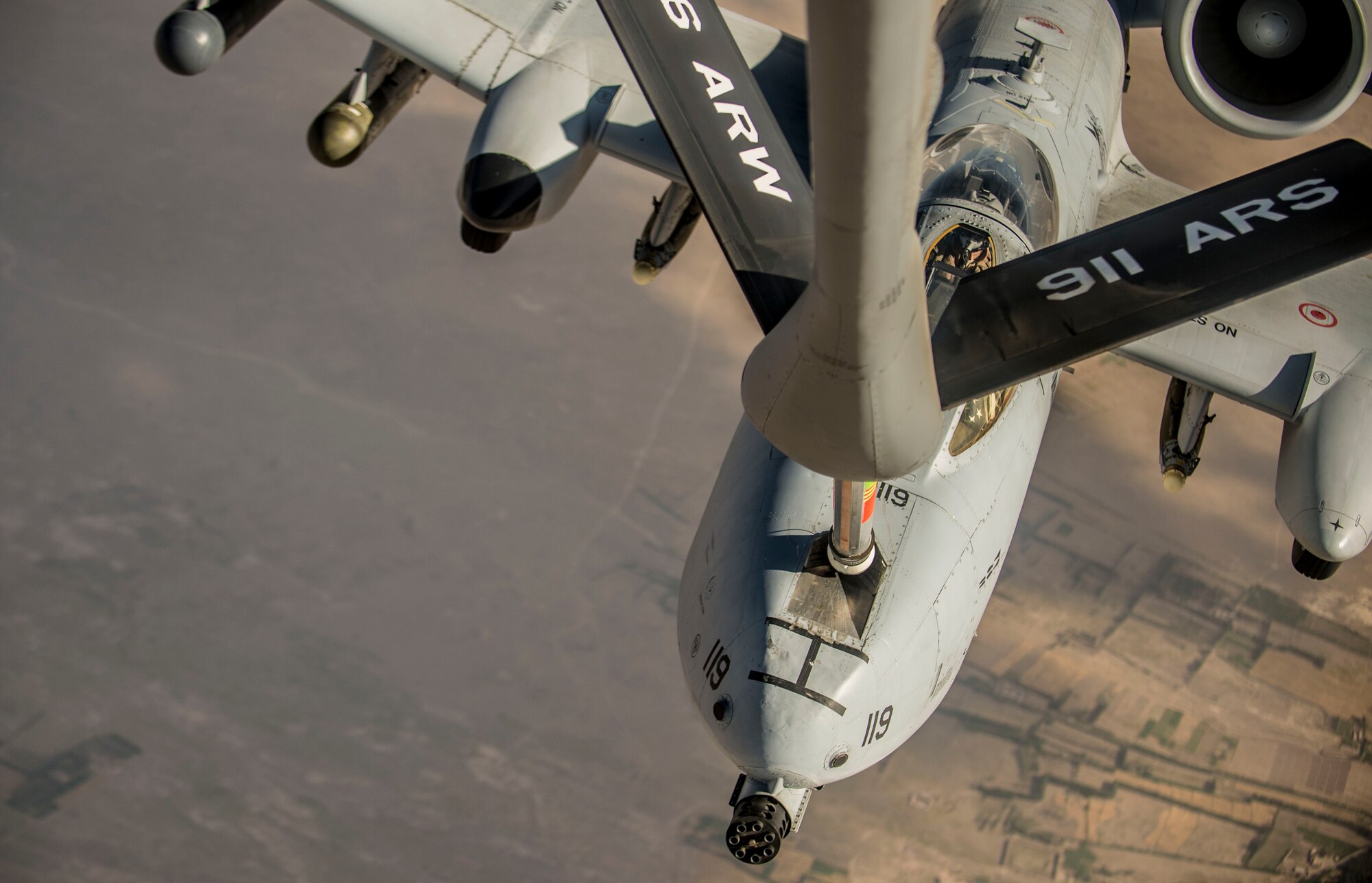 A U.S. Air Force A-10 Thunderbolt II with the 303rd Expeditionary Fighter Squadron, Bagram Airfield, Afghanistan, receives fuel from a KC-135 Stratotanker from the 340th Expeditionary Air Refueling Squadron out of Al Udeid Air Base, Qatar over Eastern Afghanistan, July 10, 2014.The A-10's maneuverability at slow speeds and low altitude has made it one of the most utilized aircraft for close air support throughout Operation Enduring Freedom. (U.S. Air Force photo by Senior Airman Matthew Bruch/Released)
