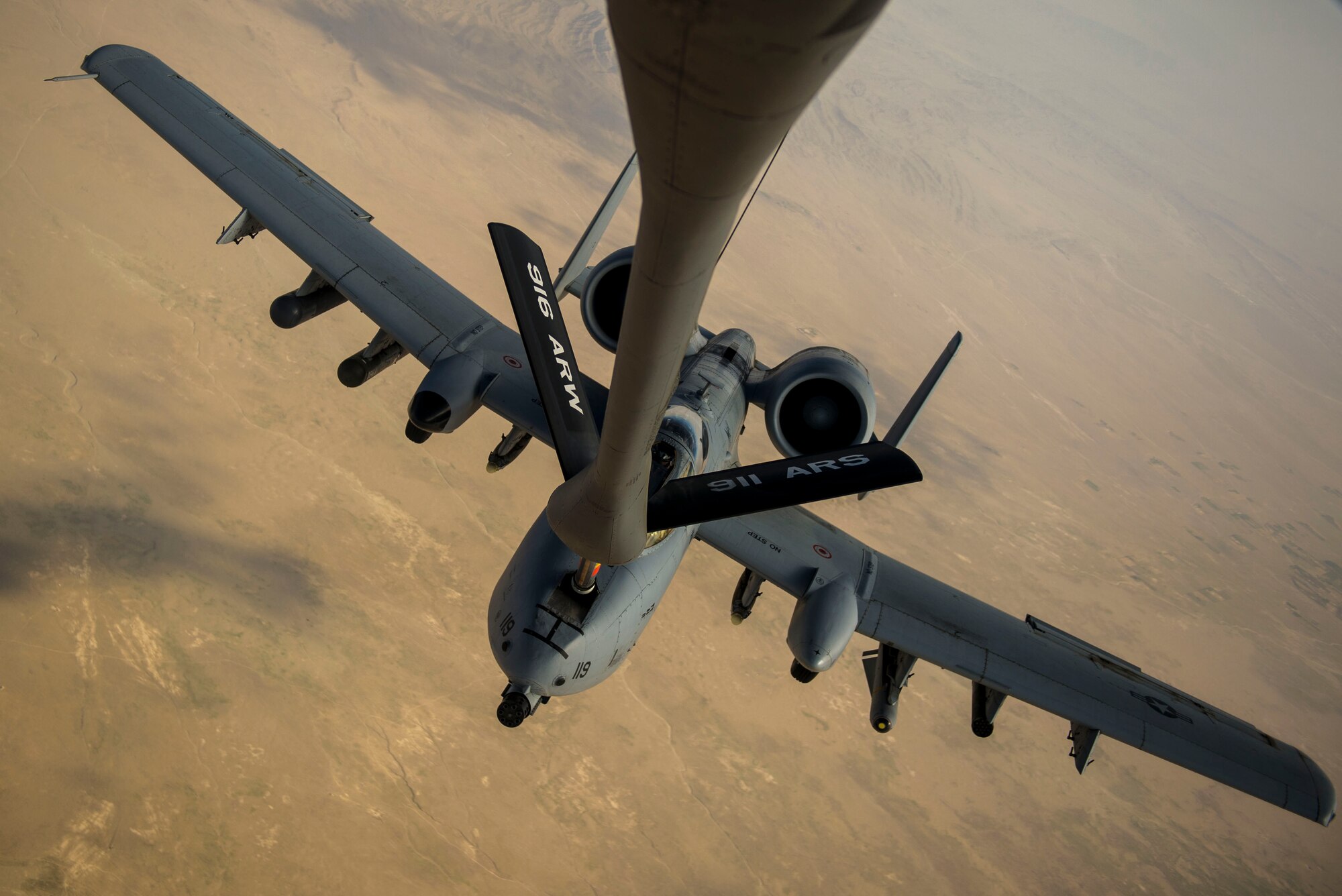 A U.S. Air Force A-10 Thunderbolt II with the 303rd Expeditionary Fighter Squadron, Bagram Airfield, Afghanistan, receives fuel from a KC-135 Stratotanker from the 340th Expeditionary Air Refueling Squadron out of Al Udeid Air Base, Qatar over Eastern Afghanistan, July 10, 2014. The A-10's maneuverability at slow speeds and low altitude has made it one of the most utilized aircraft for close air support throughout Operation Enduring Freedom. (U.S. Air Force photo by Senior Airman Matthew Bruch/Released)