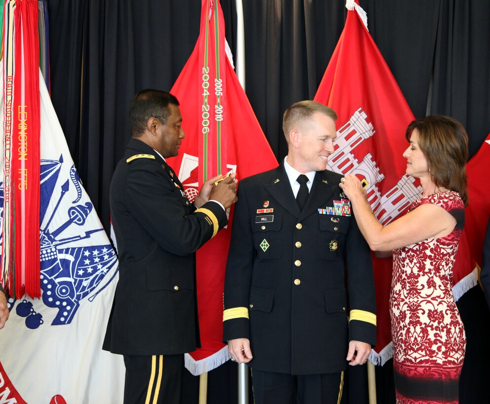 Lt. Gen. Thomas P. Bostick (left), commanding general of the U. S. Army Corps of Engineers, and Mrs. Hill pin the brigadier general star on Brig. Gen. David C. Hill in a ceremony Aug. 8 at Fort Belvoir, Va.  