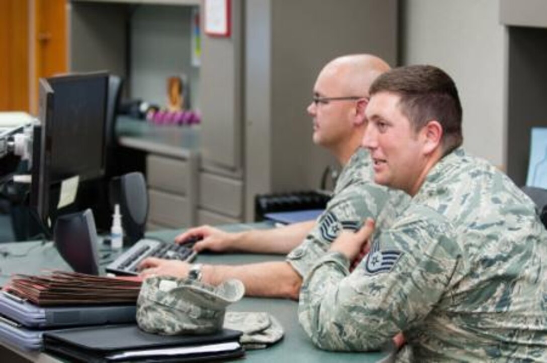 Air Force Tech. Sgt. Rodger Reed, left, and Staff Sgt Lawrence Krug, both from 164th Logistics Readiness Squadron, learn to manage and track equipment assets on Joint Base Elmendorf-Richardson (JBER), Alaska, July 16, 2014. Reed and Krug were attending their two-week annual training on JBER. (U.S. Air National Guard photo by Staff Sgt Allan Eason/Released)














