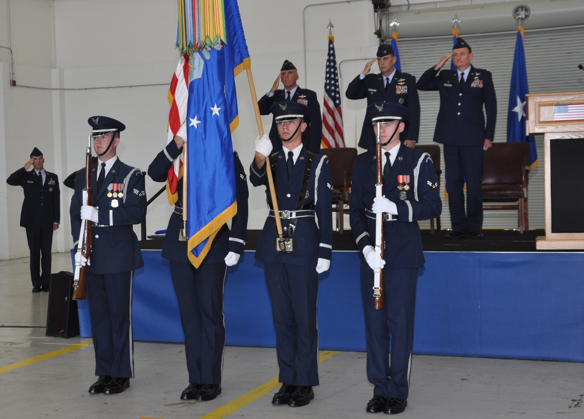 The United States Air Force Honor Guard presents the colors at the commencement of the 459th Air Refueling Wing change of command ceremony held in Hangar 10 on August 16, 2014. Col. William H. Mason relinquished command of the 459 ARW to Col. Thomas K. “T.K.” Smith Jr. (U.S. Air Force photo/ Staff Sgt. Amber J. Russell)