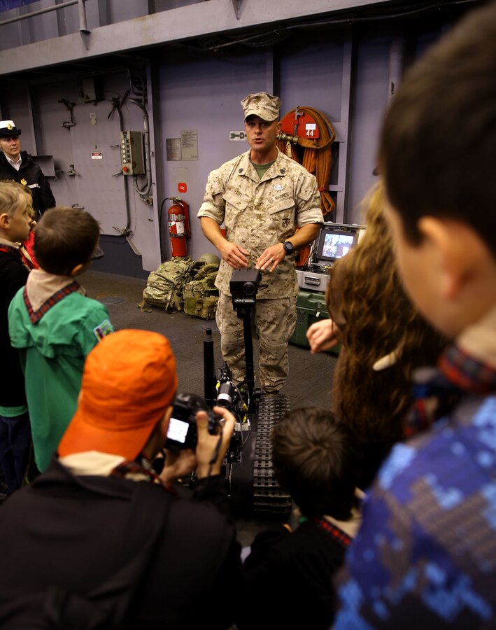 Staff Sergeant Robert T. Friel, an explosive ordnance technician with 8th Engineer Support Battalion in Camp Lejeune, N.C., shows a Canadian tour group the equipment EOD technicians use when forward deployed while aboard the USS Oak Hill during the Rendezvous Naval de Quebec in Quebec City, Canada, June 13, 2014. Marines and Sailors are participating in Quebec’s naval celebration in order to educated them on the United States’ naval capabilities, the Marine Corps’ Marine Air-Ground Task Force, and further strengthen relations with our partner nation.


