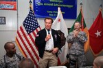 California Gov. Arnold Scharzenegger greets Soldiers from the 49th Military Police Brigade of the California National Guard at the Oasis dining facility at Camp Victory, Iraq Nov. 15, 2009. He announced today a new state initiative to better help returning combat veterans to land jobs and get whatever help they need in securing housing, health care and other veterans' services.
