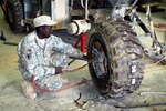 Sgt. Willie Daggins, a light wheel vehicle mechanic with the 1218th Transportation Co., of the Florida National Guard, continues to fix tires after 28 years in the same National Guard unit. The 1218th TC is supported by the 751st Combat Sustainment Support Battalion, 96th Sustainment Brigade, 13th Sustainment Command (Expeditionary)