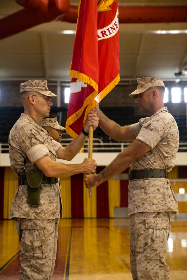 Sgt. Maj. Michael P. Woods (right), the sergeant major of 6th Marine Regiment, 2nd Marine Division, passes the battalion colors to Col. Ryan P. Heritage, the regiment’s outgoing commanding officer, during a change of command ceremony at Camp Lejeune, N.C., July 10, 2014. The colors were then passed from the outgoing commanding officer to the incoming one as an official passing of command. (U.S. Marine Corps photo by Lance Cpl. Kaitlyn Klein)


