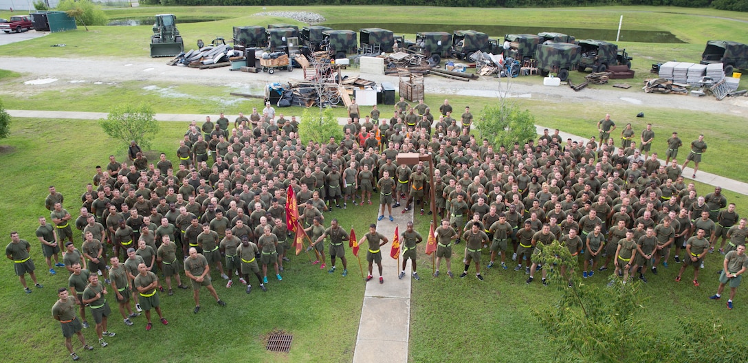 Lt. Col. Derek E. Lane, the commanding officer for 8th Communication Battalion, 2nd Marine Logistics Group, gives a post-event speech to his Marines following the company’s Trash Dash event aboard Camp Lejeune, North Carolina, July 11, 2014. (U.S. Marine Corps photo by Pfc. Lucas J. Hopkins/Released).