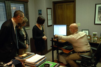 Tennessee Valley Healthcare system Public Affairs Officer, Christopher Alexander, demonstrates a Veteran's Affairs Healthcare database to members of the Bulgarian contingent visiting Tennessee as part of the State Partnership Program Dec. 8.