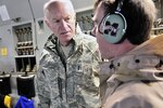 Adm. Mike Mullen, chairman of the Joint Chiefs of Staff, greets Spc. Dennis Morgan Jr. and Autumn Gustausen during a departure ceremony for Vermont National Guard in Burlington, Vt., on Jan. 8, 2010. Morgan is deploying for a yearlong tour to Afghanistan as a member of the 86th Infantry Brigade Combat Team.