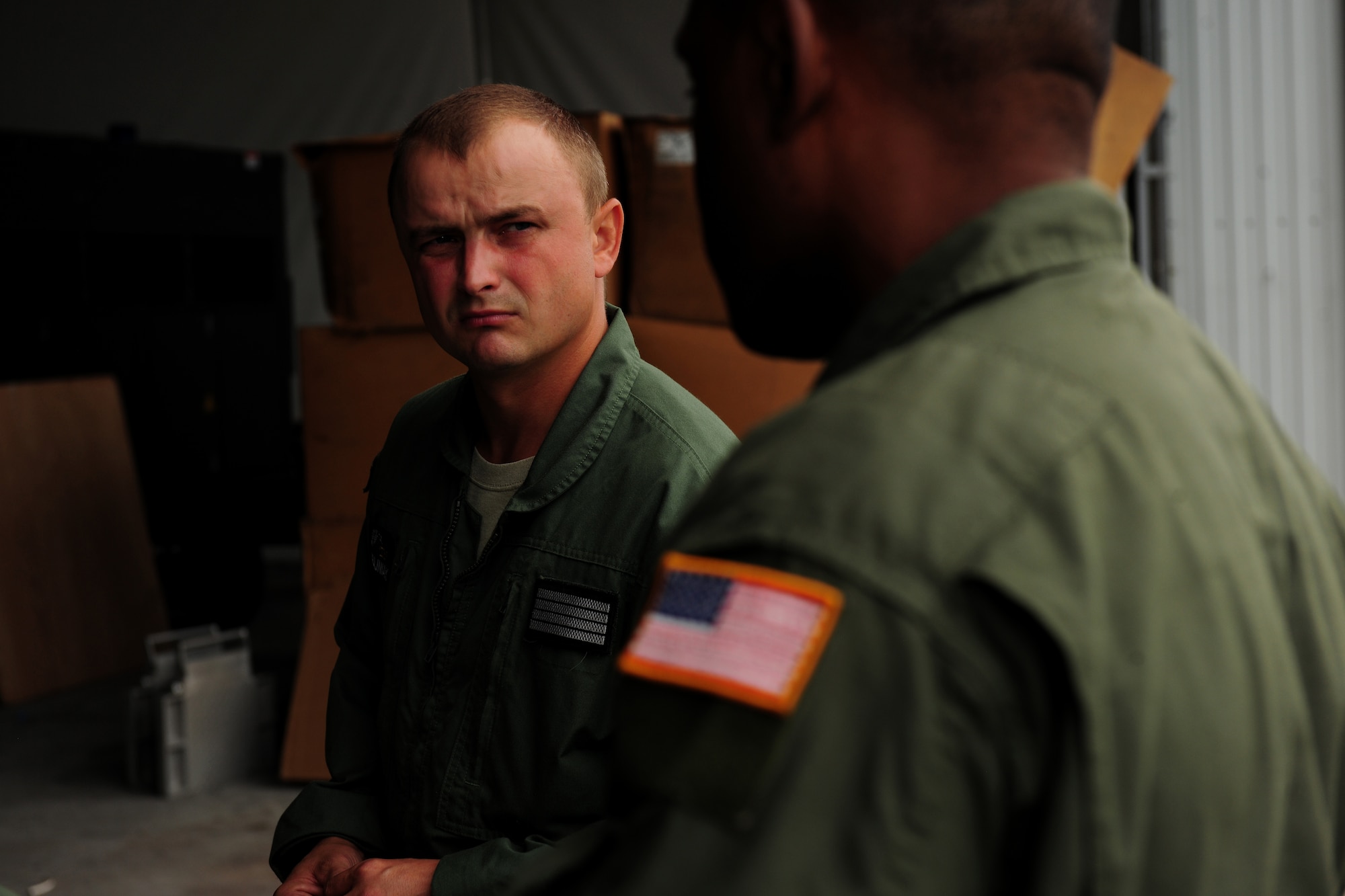 Polish air force Sgt. Zbigniew Krajniak  discusses mass container delivery airdrop operations with U.S. Air Force Master Sgt. Chris Minnifield Aug. 11, 2014, at Powidz Air Base, Poland. The discussion served as refresher training for Polish forces preparing to deliver equipment and supplies to Iraq.  Krajniak is a 33rd Transportation Air Base loadmaster and Minnifield is a 37th Airlift Squadron loadmaster. (U.S. Air Force photo/Staff Sgt. Jarad A. Denton)
