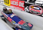 A New York Army National Guard Soldier from the 2nd Battalion, 108th Infantry Regiment, keeps his head down while serving as brakeman on a sled as it speeds down the Mount Van Hoevenberg bobsled track during the Geoff Bodine Bobsled Challenge in 2009.