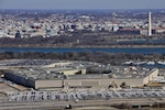 The Pentagon with the Washington Monument and National Mall in the background. Military personnel will have the opportunity to participate in a confidential survey.